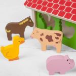 Imagen de Casa Granja de encastre y clasificación en madera Bigjigs